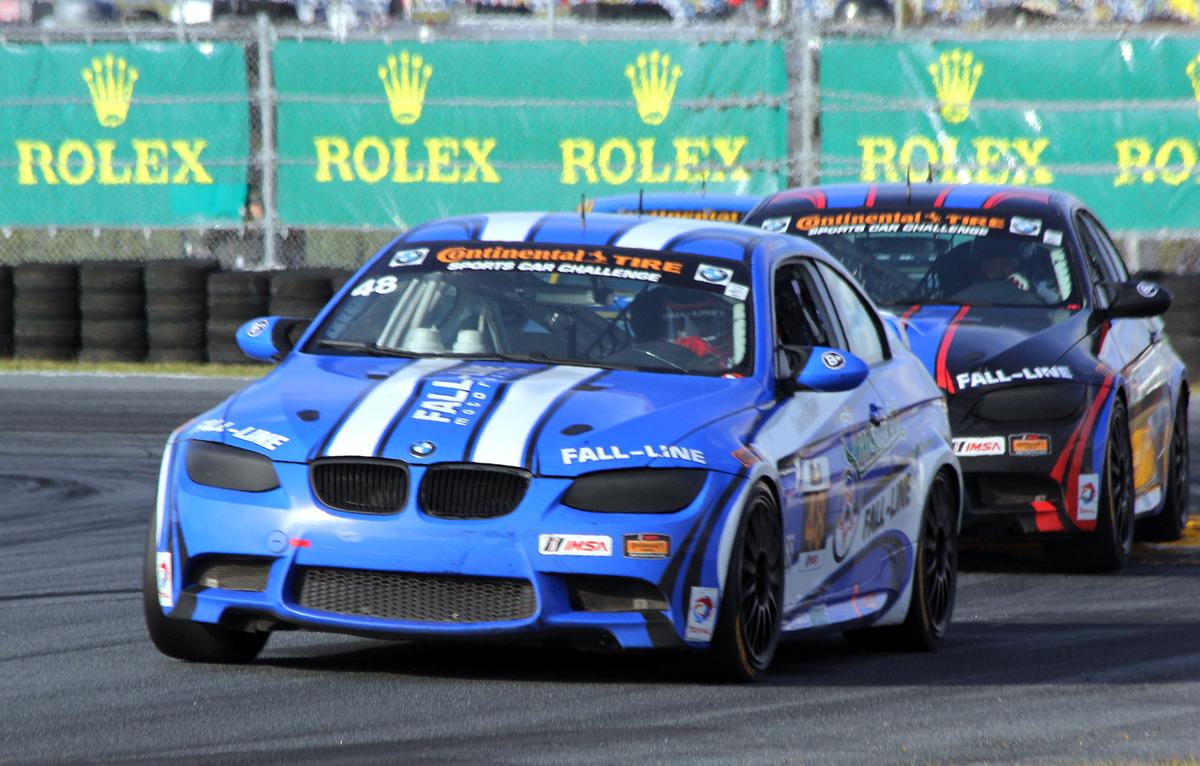 Shelby Blackstock holds off the #46 Fall-Line BMW late in the closing laps of the BMW 200. (Chris Jasurek/Epoch Times)
