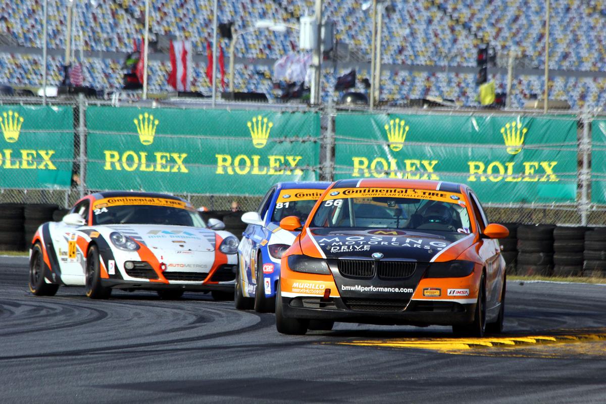 ST was a tight fight right to the end: here Eric Foss in the #56 Murillo BMW leads the next two cars in the ST class with a few laps left in the race. (Chris Jasurek/Epoch Times)