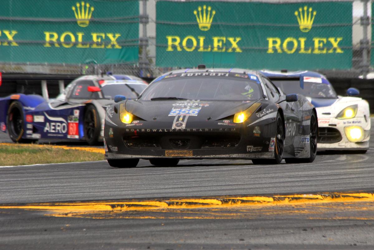 The GTD class-winning #555 Level 5 Ferrari, covered in dirt but running strong, exits the East Horseshoe half an hour from the end of the Rolex 24. (Chris Jasurek/Epoch Times)