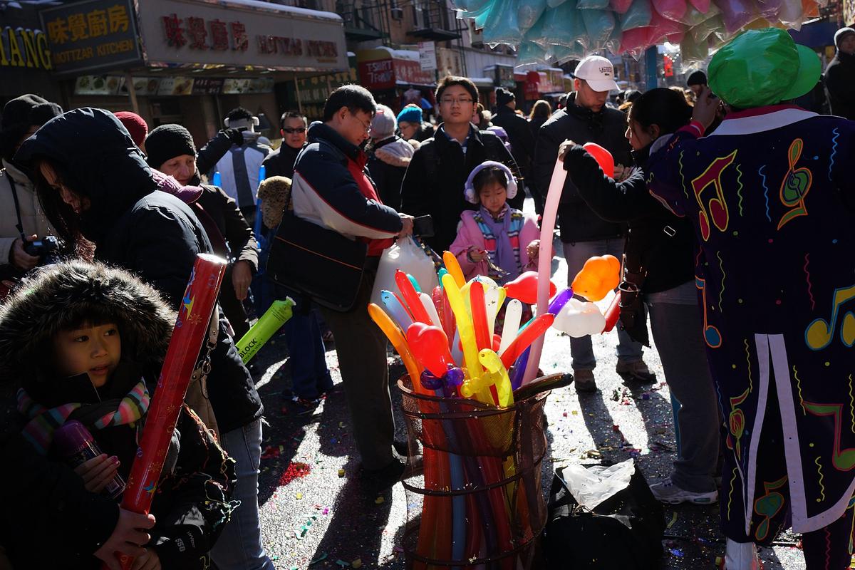 Members of the Chinese American community, tourists and other New Yorkers celebrate the first day of the Lunar New Year in New York's Chinatown on February 10, 2013. The lighting of firecrackers is believed to ward off evil spirits and to bring the god of wealth into people's lives once New Year's Day arrives. (Spencer Platt/Getty Images)