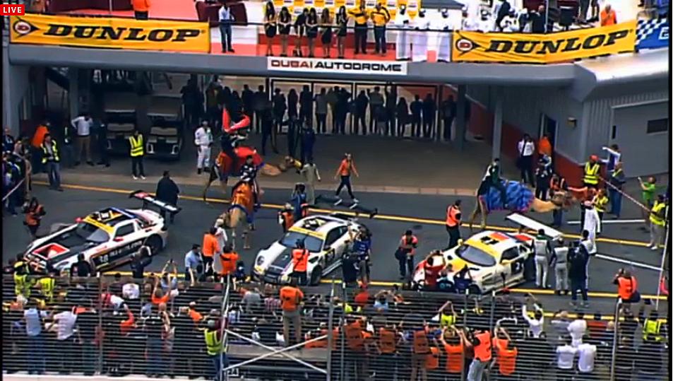 After the race the winners of the Dunlop Dubai 24 traditionally ride camels around the podium. (Screenshot from live.24hseries.com)