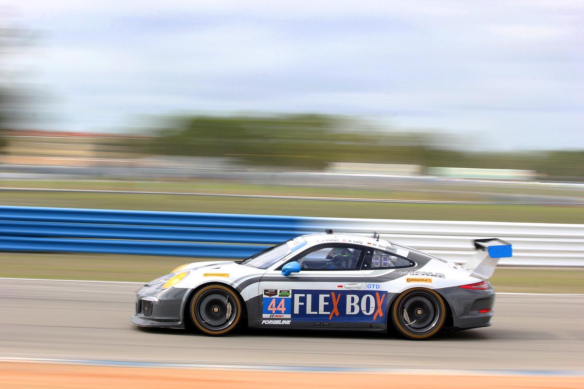 The #44 GTD Magnus Porsche streaks towards Turn 11 Friday morning. (Chris Jasurek/Epoch Times)