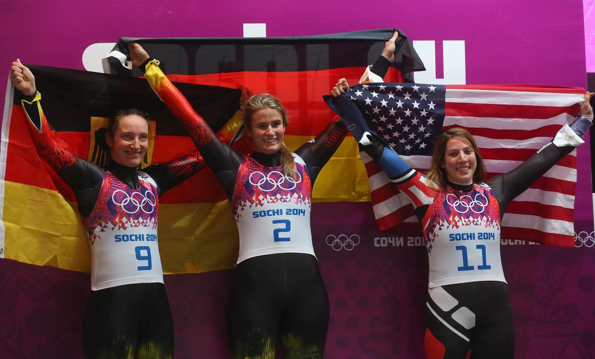 Gold medalist Natalie Geisenberger (C), silver medalist Tatjana Huefner (L) of Germany and bronze medalist Erin Hamlin of the United States celebrate after the Women's Luge Singles on Day 4 of the Sochi 2014 Winter Olympics at Sliding Center Sanki on February 11, 2014 in Sochi, Russia. (Alexander Hassenstein/Getty Images)