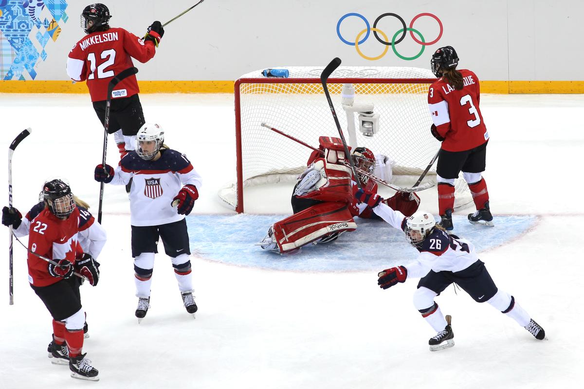 Kendall Coyne #26 of the United States celebrates as #32 Charline Labonte of Canada allows a goal by Anne Schleper #15 in the third period during the U.S.-Canada Women's Ice Hockey Preliminary Round Group A game. (Bruce Bennett/Getty Images)