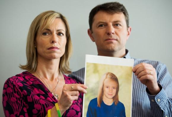 Parents of Madeleine McCann, Kate and Gerry McCann, hold an artist's impression of how their daughter might look at the age of 9, ahead of a press conference in central London in 2012, 5 years after Madeleine's disappearance. (Leon Neal/AFP/Getty Images)