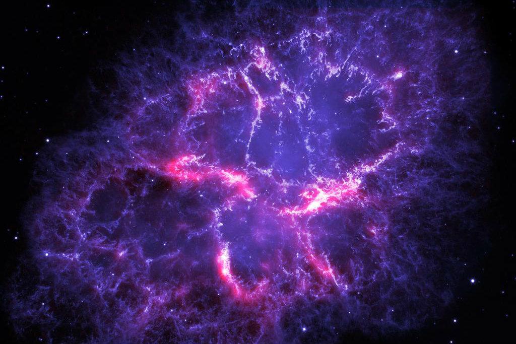 This image shows a composite view of the Crab nebula, an iconic supernova remnant in our Milky Way galaxy, as viewed by the Herschel Space Observatory and the Hubble Space Telescope. (ESA/Herschel/PACS/MESS Key Programme Supernova Remnant Team; NASA, ESA and Allison Loll/Jeff Hester, Arizona State University)
