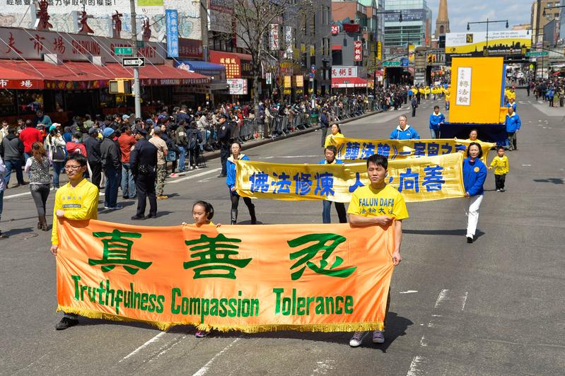 With a parade and rally in Flushing, Queens on Saturday, April 26, 2014, New Yorkers commemorate the April 25, 1999 peaceful appeal in Beijing. (Dai Bing/Epoch Times)