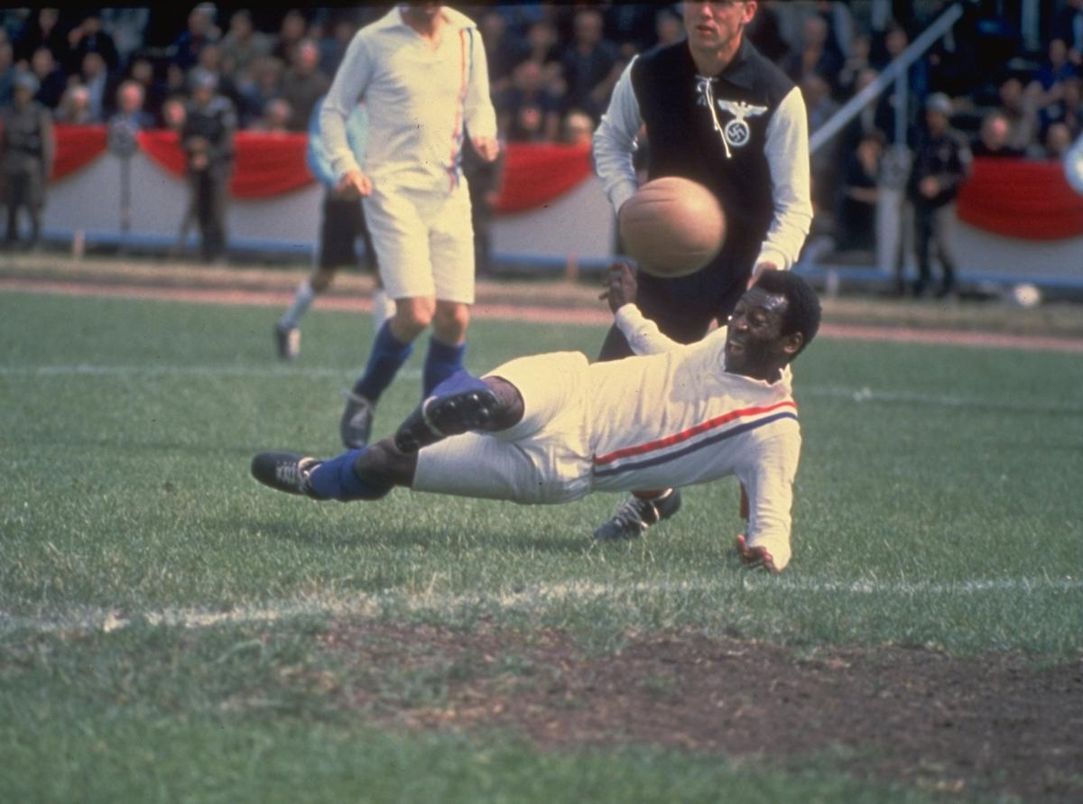 Pele of Brazil scores the equalizing goal for the Allied POW's during the match against Germany in Paris featured in the filming of ''Escape to Victory
