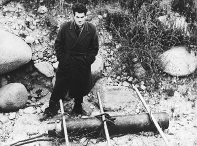 John Whiteside "Jack" Parsons standing above a jet-assisted take off canister at Jet Propulsion Laboratory's test site in the Arroyo Seco, L.A., on June 4, 1943. (NASA/JPL)
