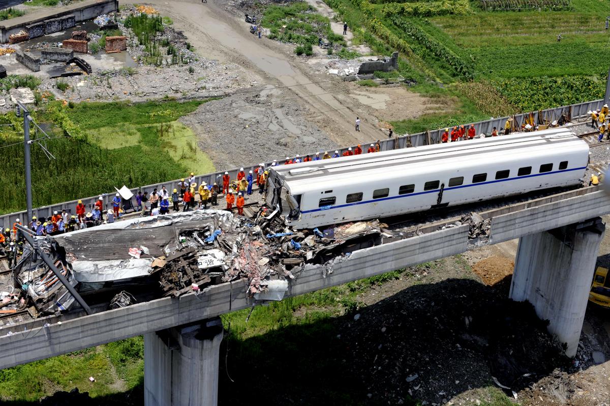 Rescue operations on the wreckage of two high-speed trains that collided on the outskirts of Wenzhou in the eastern Chinese province of Zhejiang on July 23, 2011. The train crash killed 35 people and injured over 200. (AFP/Getty Images)