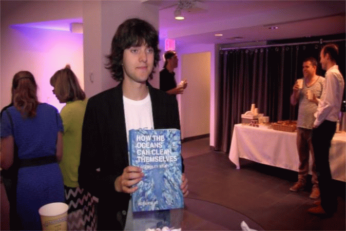 Inventor Boyan Slat holds the proof that his Ocean Cleanup system can work