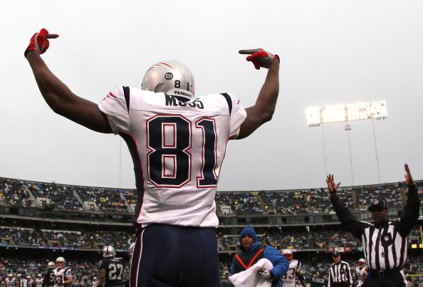 Randy Moss #81 of the New England Patriots celeberates after scoring a touchdwon against the Oakland Raiders during an NFL game on December 14, 2008 at the Oakland-Alameda County Coliseum in Oakland, California. (Jed Jacobsohn/Getty Images)