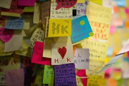 Colorful messages of hope and peace are stuck on a wall in the Central District of Hong Kong on Oct. 7, 2014. (Benjamin Chasteen/Epoch Times)