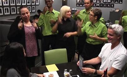 Deaf staff and restaurant manager Rachel Shemuel (far left) converse with patrons through sign language. (Courtesy Signs Restaurant & Bar)
