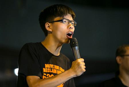 Student leader Joshua Wong speaks at a pro-democracy protest site outside the central government offices on October 19, 2014 in Hong Kong. (Paula Bronstein/Getty Images)