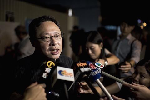  Activist Benny Tai, co-founder of the Occupy Central movement, speaks to the media at a protest outside government offices in Hong Kong on Aug. 29, 2014. Demonstrators gathered on Aug. 29 to urge universal suffrage in Hong Kong, as the top committee of China's legislature meets in Beijing to discuss political reforms in the southern city. (Alex Ogle/AFP/Getty Images)
