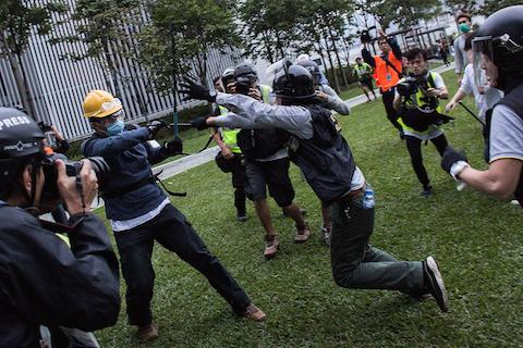 Riot police clash with pro-democracy protesters outside Central Government Complex at admiralty district on December 1, 2014 in Hong Kong. (Lam Yik Fei/Getty Images)