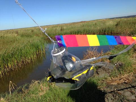 The Infragram Rig: A lightweight Mobius ActionCam, hacked to accept only infrared light, plastic bottle top, kite tail is attached to the kite. (Al Shaw/ProPublica)