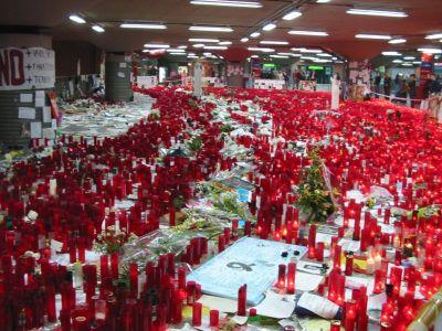 Candles and flowers cover the floor of the Atocha Railway Station in Madrid following the 2004 bombing. (Wikimedia-Commons)