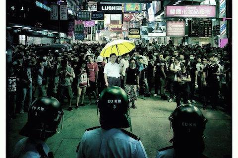 "Uncle Xi" leads a Mong Kok protester mob against police officers the only way he knows how.