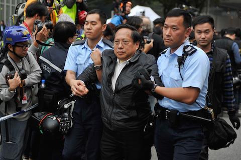 Legislator Albert Ho Chun-yan taken away by the cops during the Admiralty clearing. (Lucas Schifres/Getty Images)