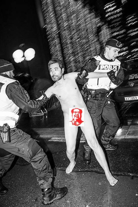 Meng Huang, a Chinese dissident, is arrested by police in Stockholm, Sweden, on Dec. 10, after running through the street naked, in a protest stunt. (Courtesy of Liao Yiwu)