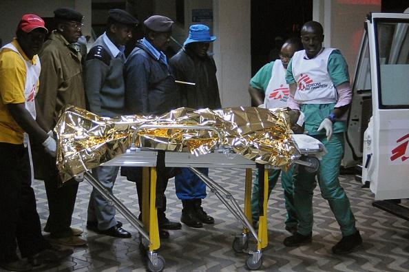A victim of a collapsed building arrives at the Kenyatta National hospital in Nairobi, on January 04, 2015. A high-rise building collapsed in the Kenyan capital on January 4, leaving at least a dozen injured and an unknown number of others trapped under rubble, officials and witnesses said. (SIMON MAINA/AFP/Getty Images)