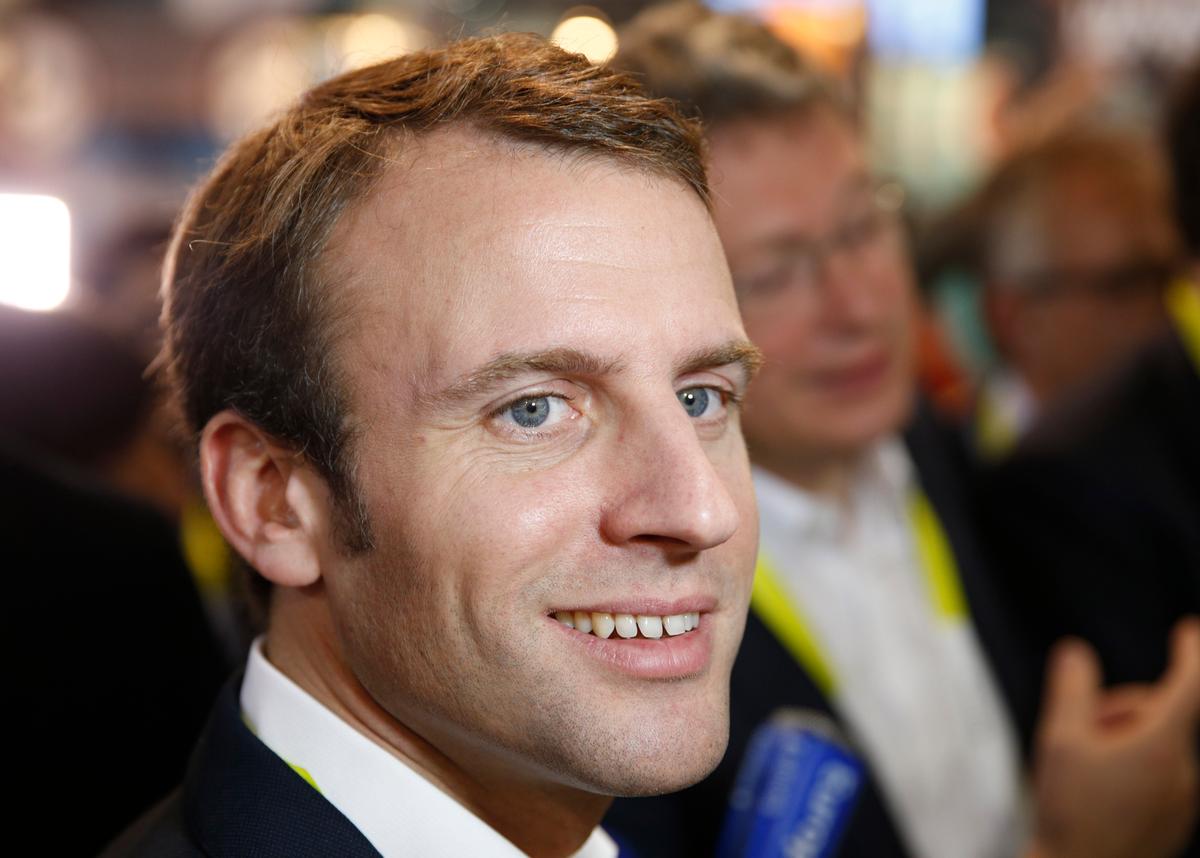 French finance minister Emmanuel Macron tours the Parrot booth at the International CES in Las Vegas on Jan. 6, 2015. (AP Photo/John Locher)
