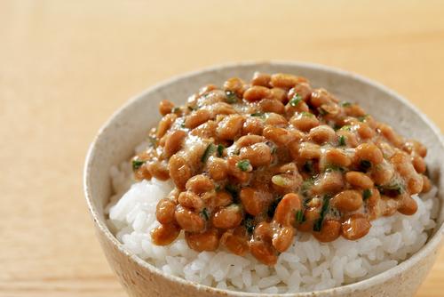 Natto is a smelly, sticky traditional Japanese food made of fermented soybeans. (<a href="http://www.shutterstock.com/pic-159421718/stock-photo-natto-fermented-soy-beans-on-rice-japanese-food.html?src=rAtE91U9K45HkP--kepgsw-6-12" target="_blank">Shutterstock/kazoka</a>)