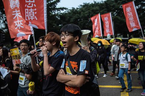 Joshua Wong, student leader, shouts as tens of thousands of protesters called for real universal suffrage during a march for democracy on Feb. 1, 2015 in Hong Kong. (Lam Yik Fei/Getty Images)