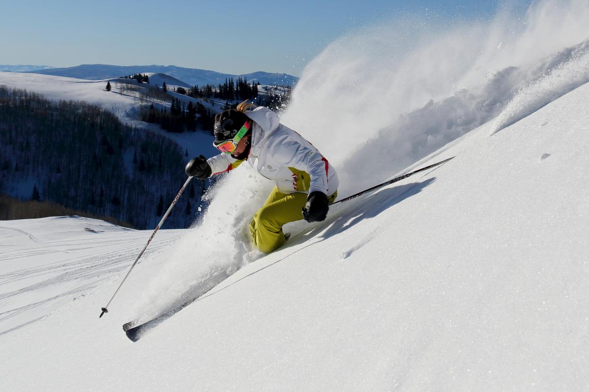 Former Olympic alpine skier Heidi Voelker rips the powder at Deer Valley. Mike and I were fortunate to have her as a guide, and in just half a day our legs were cooked chasing her through the steeps (Deer Valley Resort)