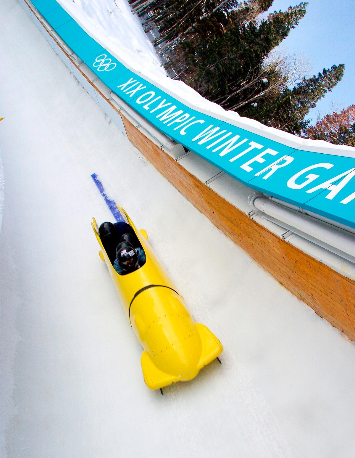 Tourists ride the Winter Comet Bobsled at the Utah Olympic Park, which is the actual track used in the 2002 Winter Olympics. (Utah Olympic Park)