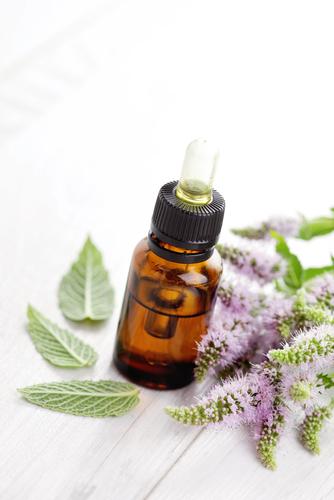 Peppermint essential oil. (<a href="http://www.shutterstock.com/pic-206491684/stock-photo-essential-oil-and-mint-health-and-beauty.html?src=cDjYgnSY8acwvdWIuKiuAg-2-0&ws=1" target="_blank">Shutterstock</a>)