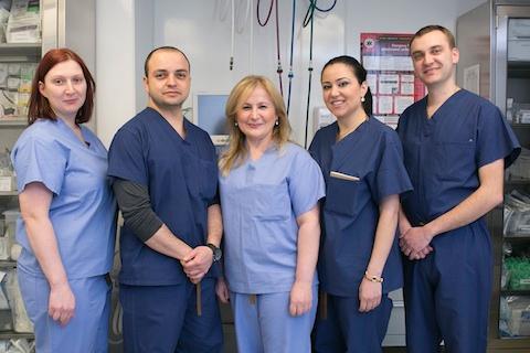 Dr. Elena Ocher (C) and her staff at her Manhattan pain management clinic, Elena Ocher Medical, Feb. 18, 2015. (Samira Bouaou/Epoch Times)