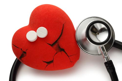 The question is now being raised whether statins have effects that actually promote atherosclerosis and heart failure. (<a href="http://www.shutterstock.com/pic-168223961/stock-photo-red-broken-heart-stethoscope-and-pills-on-white.html?src=94L4NtI-kbr4kSKgaGXqUA-1-18" target="_blank">Shutterstock</a>)