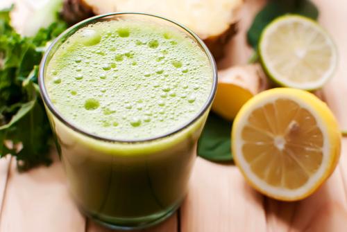 Whether its in the form of a green juice, smoothies or greens powder, green drinks are a enjoyable way to boost detoxification and promote weight loss. (<a href="http://www.shutterstock.com/pic-179173661/stock-photo-healthy-organic-green-detox-juice-on-wood.html?src=U_Ja675HpyBrTQJexbKnJA-1-89" target="_blank" rel="noopener">Shutterstock</a>)