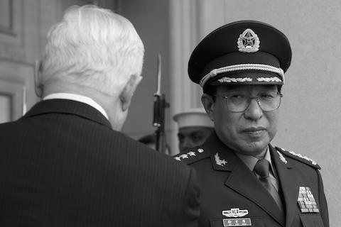 Xu Caihou (R), a formerly powerful general who recently died of bladder cancer. (Jim Watson/AFP/Getty Images)