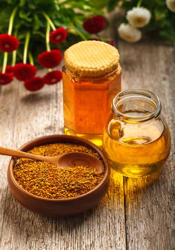 Honey and pollen (<a href="http://www.shutterstock.com/pic-154707401/stock-photo-still-life-of-jars-of-honey-and-pollen-with-a-spoon.html?src=csl_recent_image-2" target="_blank" rel="noopener">Shutterstock</a>)