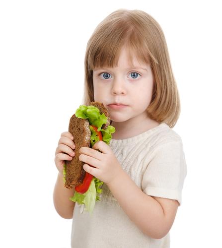 (<a href="http://www.shutterstock.com/pic-98360330/stock-photo-baby-girl-eating-sandwich-isolated-on-white-background.html?src=PS5DwrRy6S3EBRIUs8iKRA-1-1" target="_blank">Shutterstock</a>)