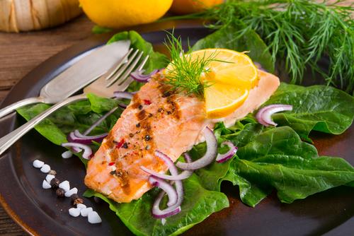 Salmon is among the most popular types of fish among health conscious individuals, for a good reason. (<a href="http://www.shutterstock.com/pic-134256092/stock-photo-grilled-salmon-fillets-on-spinach.html?src=I7woEL4sFNLIm-ueosoLTg-1-30" target="_blank">Shutterstock</a>)
