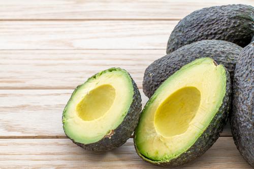 The avocado is a unique type of fruit. Instead of being high in carbs, it is loaded with healthy fats. (<a href="http://www.shutterstock.com/pic-274295936/stock-photo-avocados-on-a-wood-table.html?src=aSsC0nnENEq-fFqkqkuzKg-1-0" target="_blank">Shutterstock</a>)