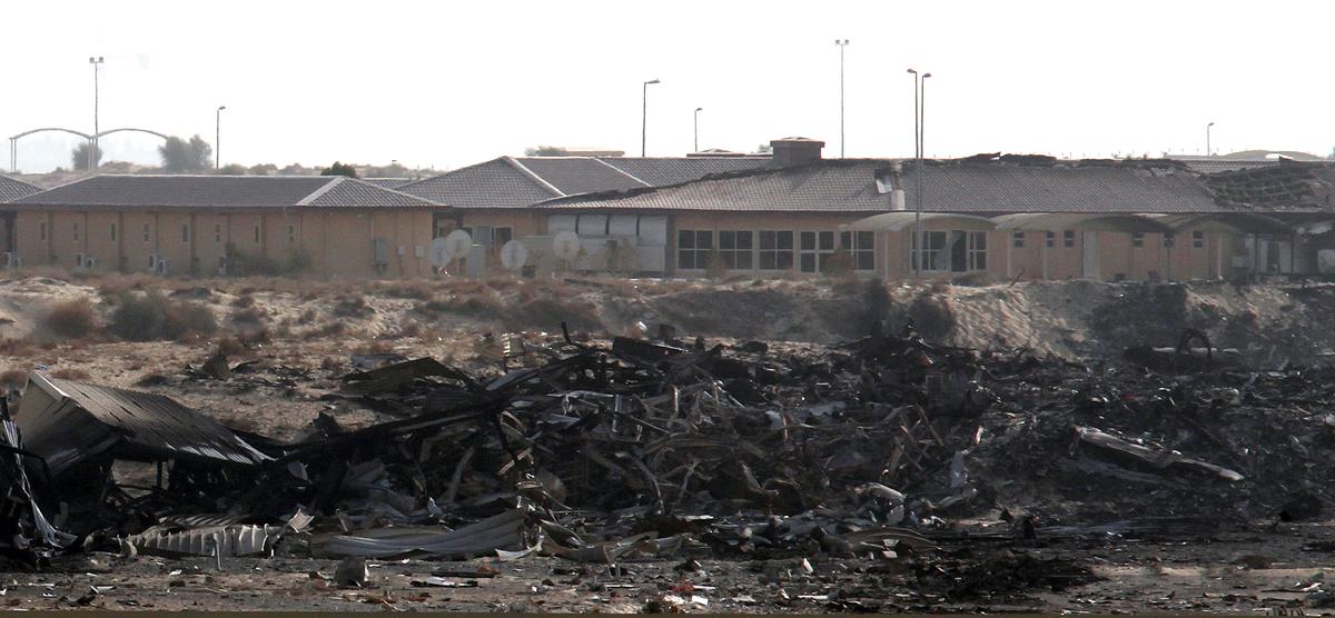 The remains of the UPS 747-400 Boeing cargo plane that went up in flames due to exploded lithium batteries in Dubai on Sept. 5, 2010. (AP Photo/File)