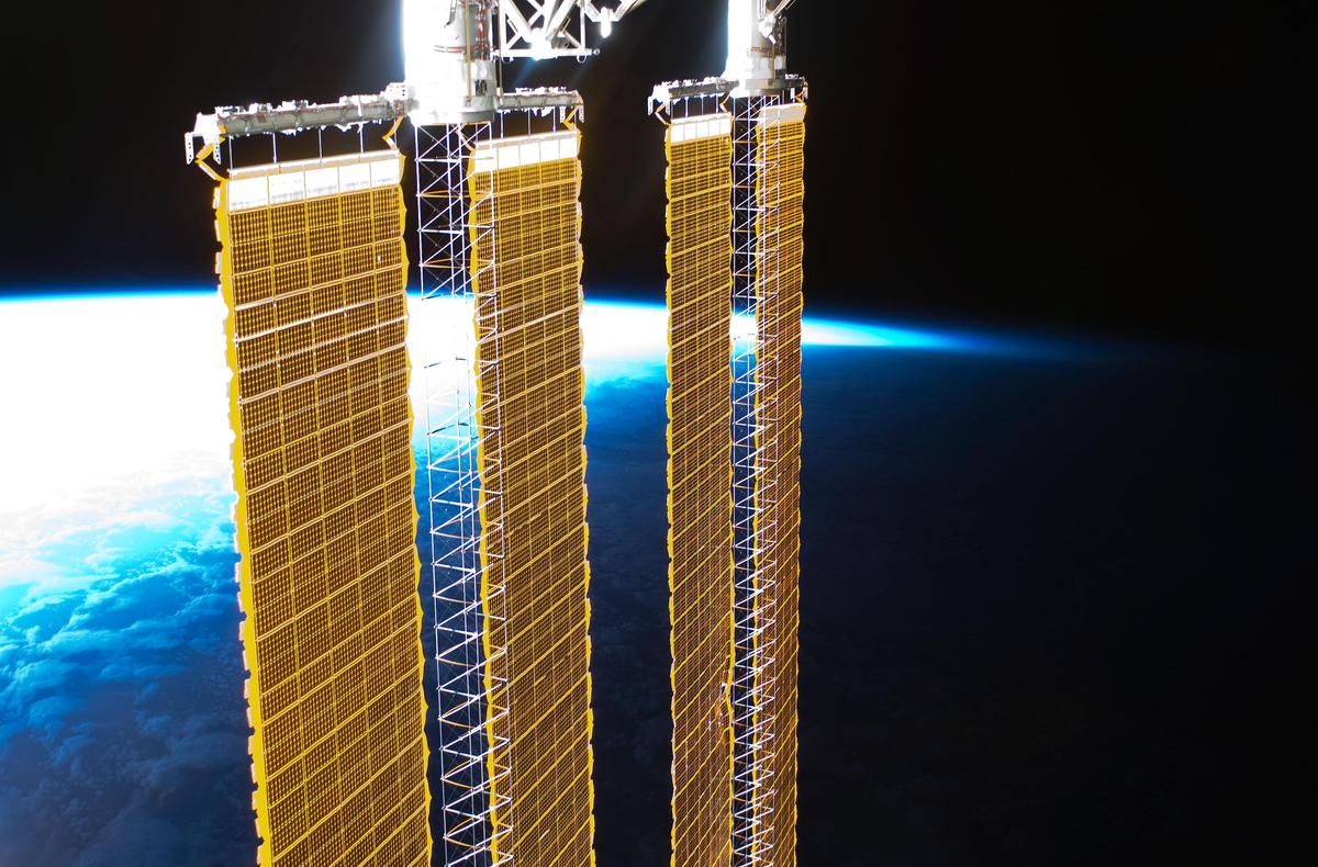Solar panels on the International Space Station. China wants to build space solar collectors many times larger that would send energy back to the ground by laser or microwave. (NASA)