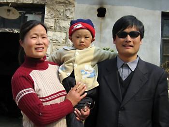 A picture dated March 28, 2005 shows blind activist Chen Guangcheng (R) with his wife and child. (STR/AFP/Getty Images)