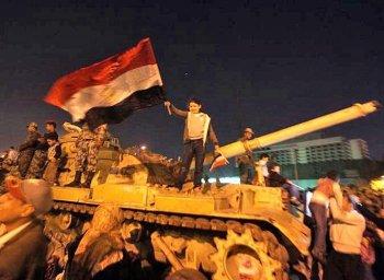 <a href="https://www.theepochtimes.com/assets/uploads/2015/07/109012469Egypt2_medium.jpg"><img class="size-medium wp-image-120654" title="An Egyptian girl waves her national flag on an M-60 tank as anti-government protesters celebrate in Cairos Tahrir Square after president Hosni Mubarak stepped down. (Patrick Baz/AFP/Getty Images)" src="https://www.theepochtimes.com/assets/uploads/2015/07/109012469Egypt2_medium.jpg" alt="An Egyptian girl waves her national flag on an M-60 tank as anti-government protesters celebrate in Cairos Tahrir Square after president Hosni Mubarak stepped down. (Patrick Baz/AFP/Getty Images)" width="320"/></a>