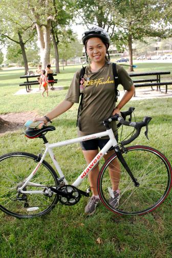 Ride2Freedom cyclist from USA, Annie Chen, poses with her bicycle at South Park, Lawrence, Kan. on June 25, 2015.(Cat Rooney/Epoch Times)