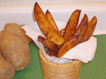 <a href="https://www.theepochtimes.com/assets/uploads/2015/07/20090127CuisineOvenroastedpotatowedges_medium.jpg"><img src="https://www.theepochtimes.com/assets/uploads/2015/07/20090127CuisineOvenroastedpotatowedges_medium.jpg" alt="No deep-frying for these potato wedges—they are oven-roasted to a golden brown. (Sandra Shields/The Epoch Times)" title="No deep-frying for these potato wedges—they are oven-roasted to a golden brown. (Sandra Shields/The Epoch Times)" width="300" class="size-medium wp-image-64750"/></a>