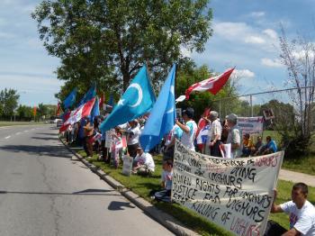 Uyghurs and supporters protest across the street from the Chinese embassy in Ottawa calling on the Chinese regime to stop its violence and rights abuses against the Uyghur people in northwest China. (The Epoch Times)