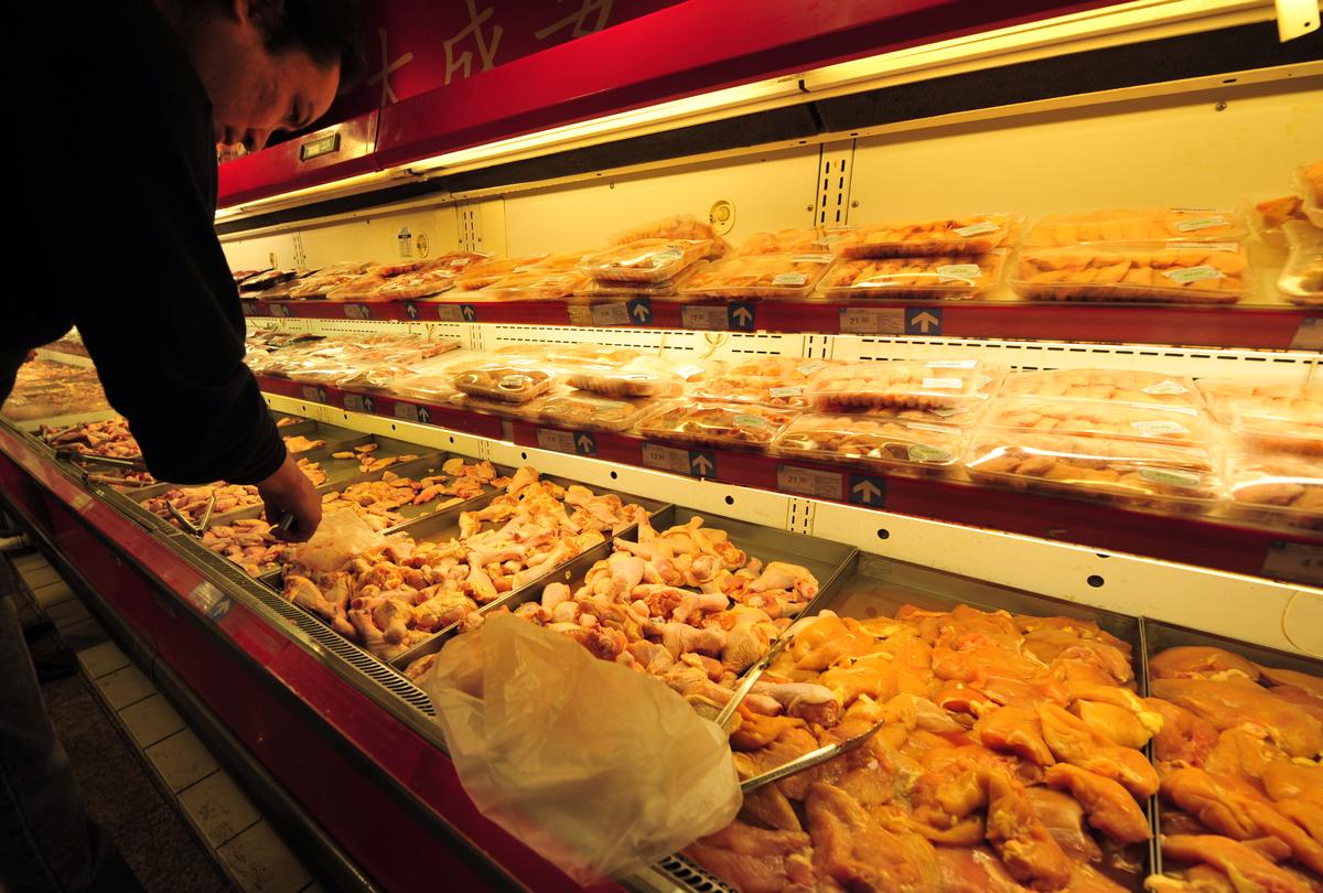 Frozen chicken wings line a supermarket shelf in Beijing. (FREDERIC J. BROWN/AFP/Getty Images)
