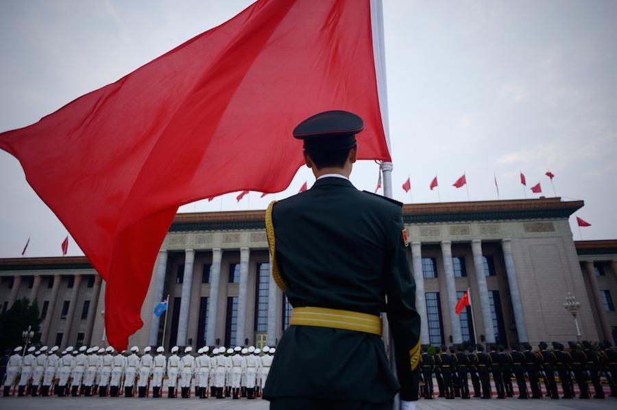 Like this Chinese guard, authorities regularly turn their backs on food violations in China allowing problems to proliferate. (Wang Zhao/AFP/Getty Images)